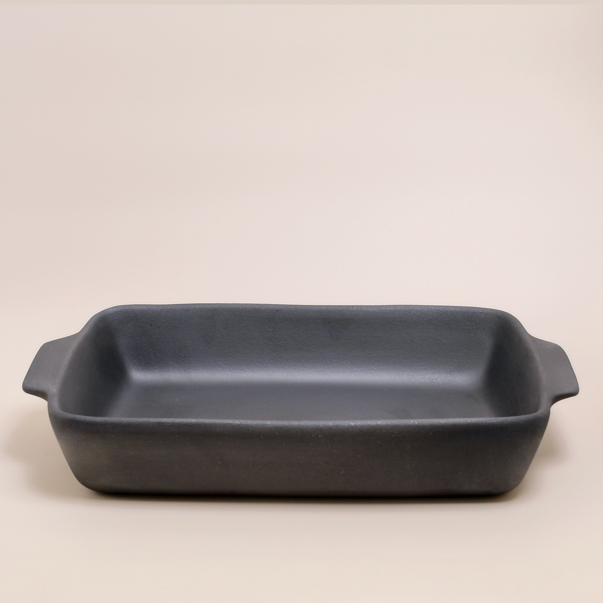 Handcrafted Portuguese black clay oven dish — large unglazed terracotta baking tray for rustic oven-to-table cooking and serving