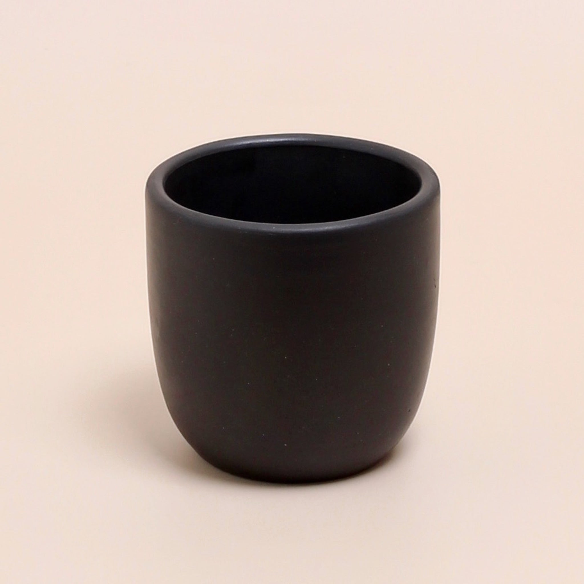 Handcrafted black clay tumbler cup — minimalist unglazed ceramic for coffee, tea, wine, or juice with rustic natural texture