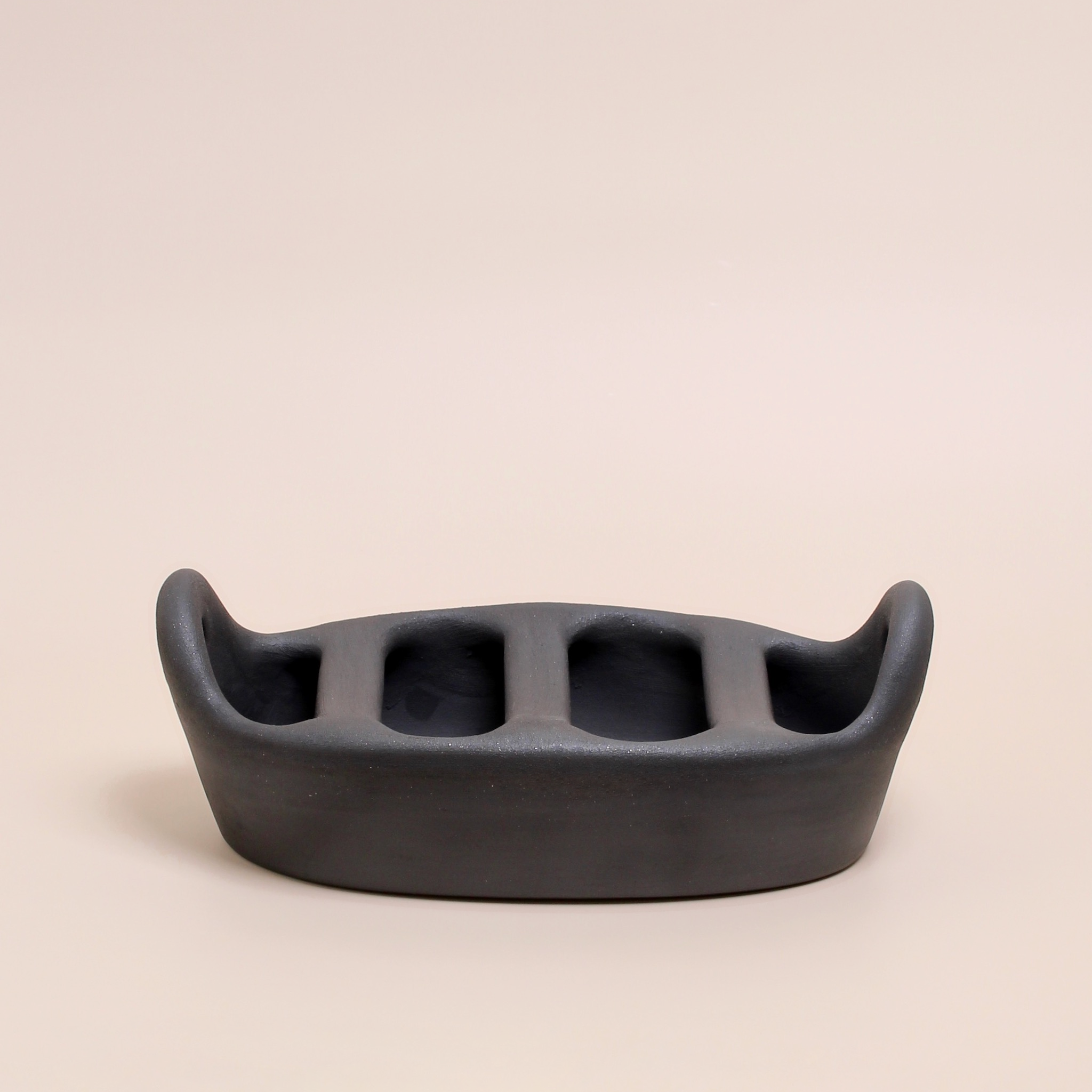 Handcrafted Portuguese clay chouriço grill — traditional black terracotta sausage roaster made from natural clay, perfect for open flame cooking