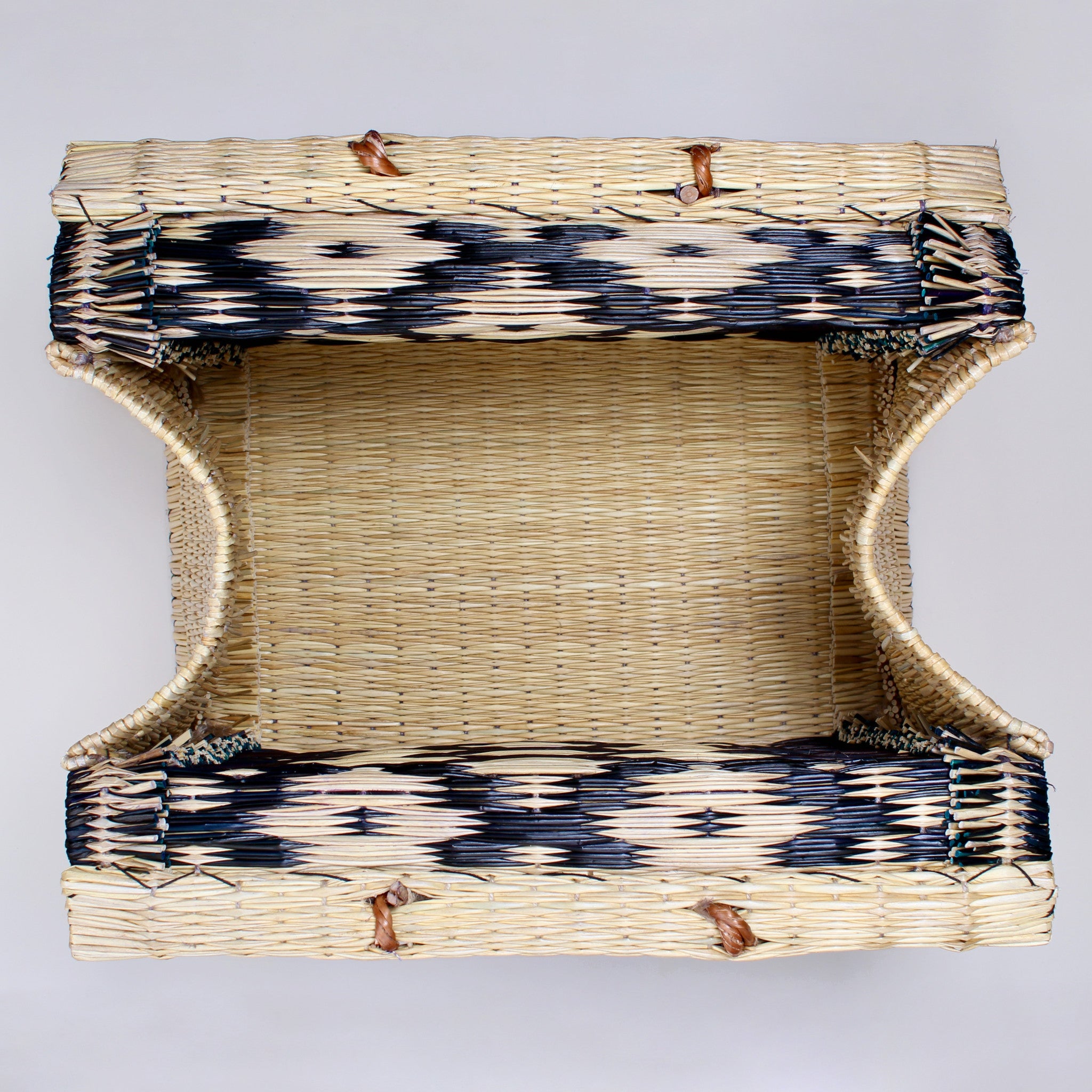 Handwoven reed basket with bold multicolor patterns — artisanal tote for market shopping, beach, or everyday use

