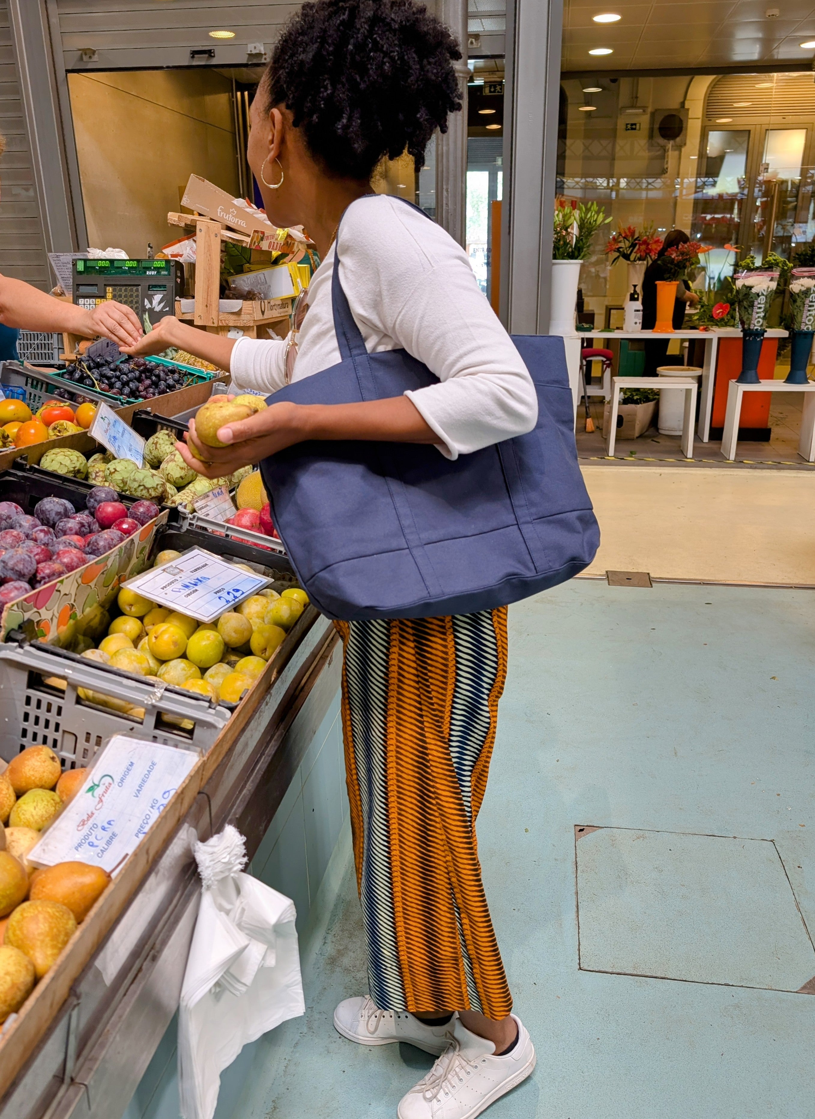 shopping on market with blue tote marketbag