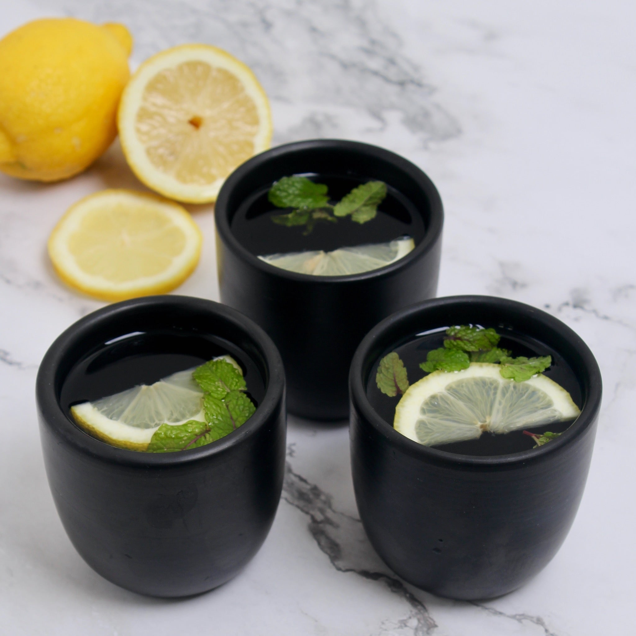 Handcrafted black clay tumbler cup — minimalist unglazed ceramic for coffee, tea, wine, or juice with rustic natural texture