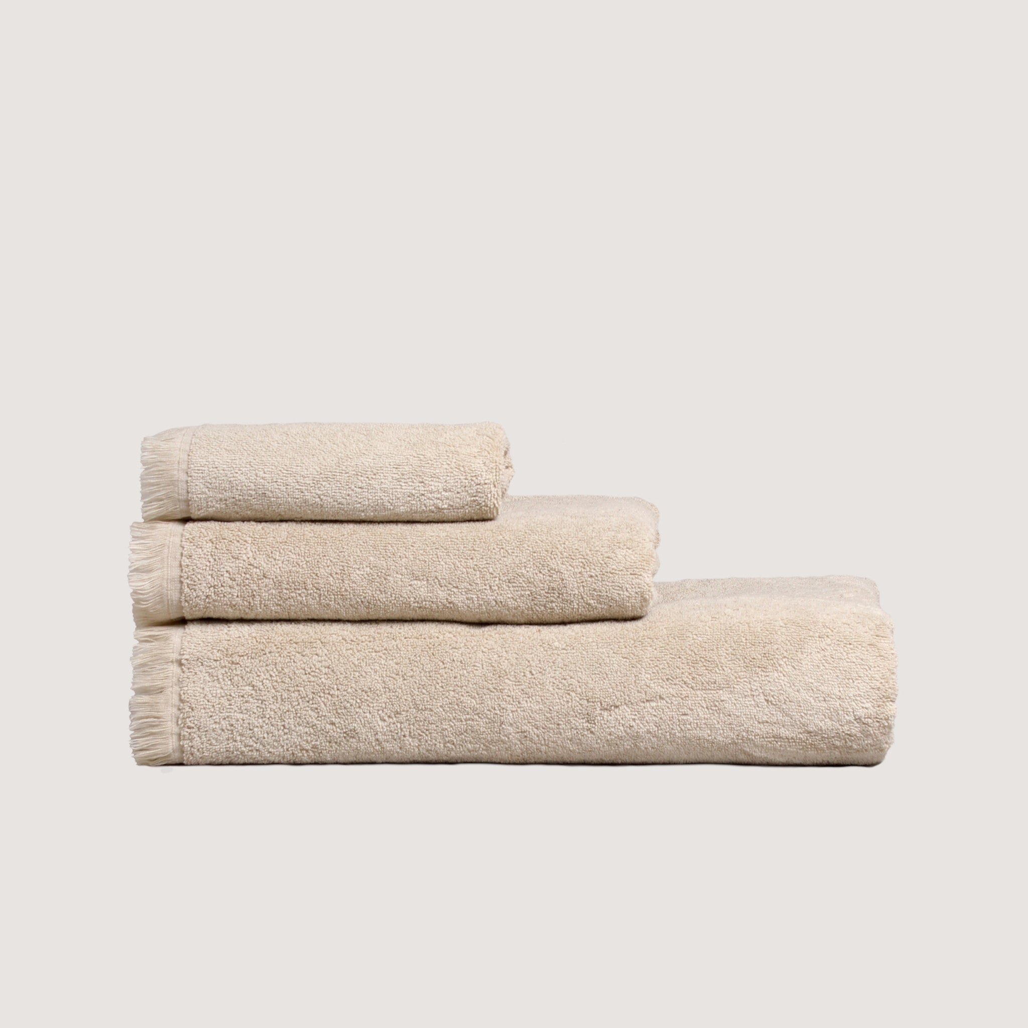 Luxurious 3-piece cotton terry towel set with fringed edges — includes face, hand, and bath towels for elegant bathroom essentials