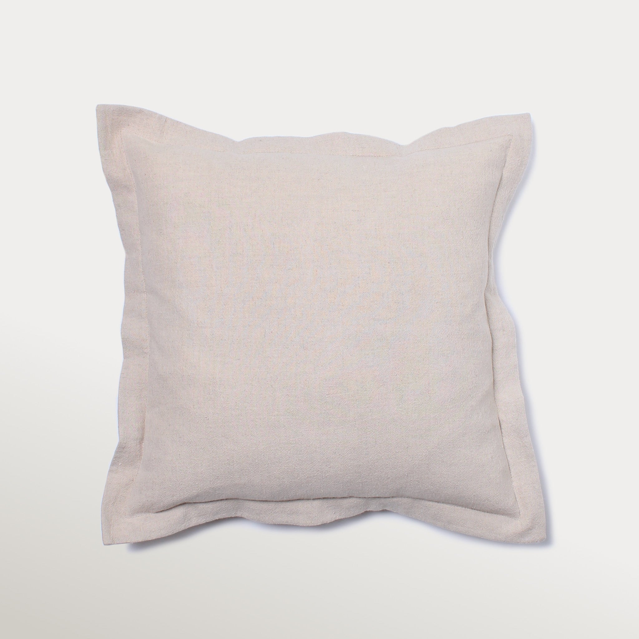 Handcrafted organic cotton and linen pillow cover with subtle piping and hidden zipper — natural textured cushion for rustic, modern, and eco-friendly home interiors