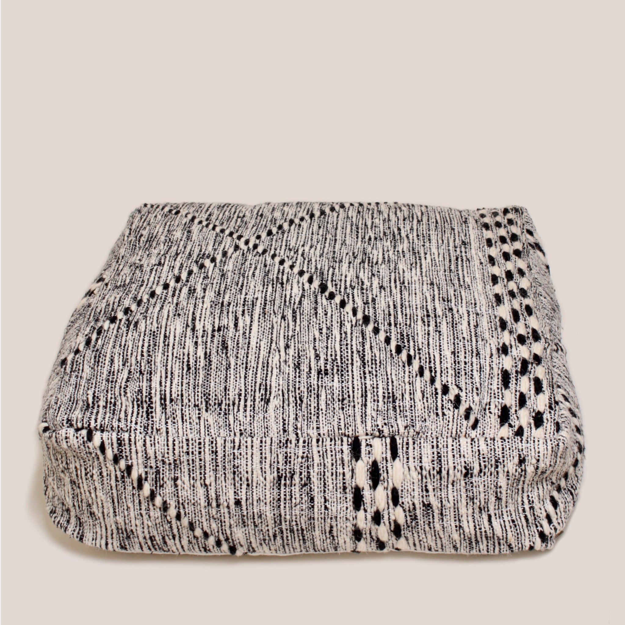 Black and beige Moroccan wool pouf with handcrafted Berber patterns, 60×60×20 cm artisan floor cushion with traditional geometric design